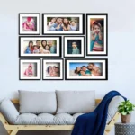 eight Photo frames in a common wall with a sofa on its bottom